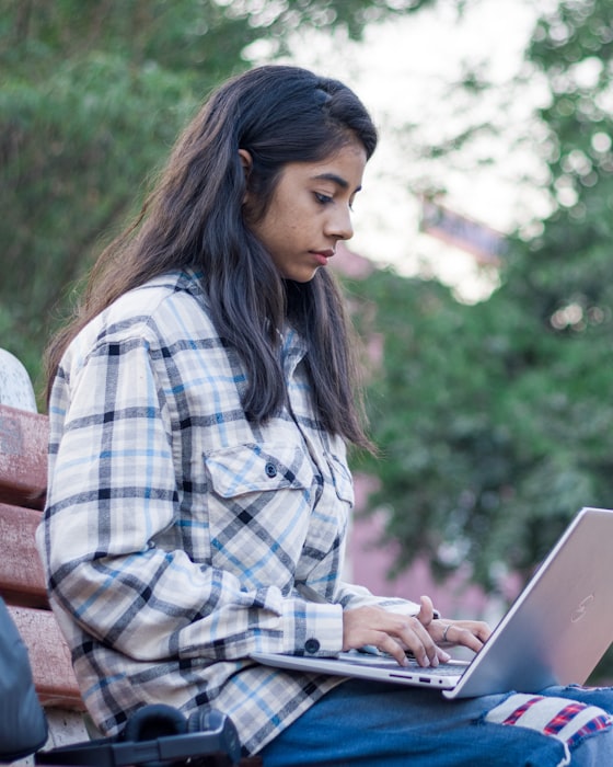 A student working through a course on her laptop